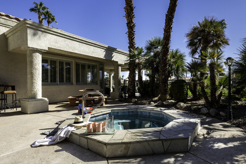 Patio view of golf course Hot tub spa in this 3BR/3BA house for rent in the Coachella Valley area